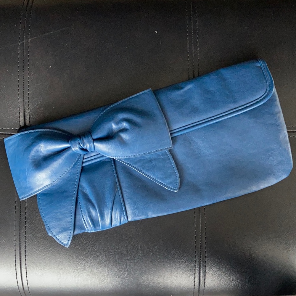 Blue clutch with a bow